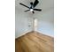 Bedroom features updated ceiling fan, wood-look floors, and closet at 2818 Geoffrey Dr, Orlando, FL 32826