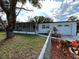 Charming single-story home featuring a screened in porch and an attached one car garage at 2818 Geoffrey Dr, Orlando, FL 32826