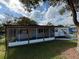 Charming single-story home featuring a screened in porch and an attached one car garage at 2818 Geoffrey Dr, Orlando, FL 32826
