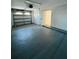 Spacious garage features a roll-up door and ample room for storage or parking at 2818 Geoffrey Dr, Orlando, FL 32826