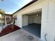 Attached one-car garage featuring freshly painted walls and flooring at 2818 Geoffrey Dr, Orlando, FL 32826