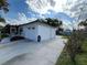 Exterior of the house showing a paved driveway leading up to the garage door at 2818 Geoffrey Dr, Orlando, FL 32826