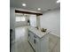 Open-concept kitchen with granite island, recessed lighting, and easy access to the living area at 2818 Geoffrey Dr, Orlando, FL 32826