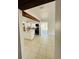 Bright, open-concept kitchen featuring white cabinetry and a large island, seamlessly connecting to the living area at 2818 Geoffrey Dr, Orlando, FL 32826