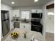 Well-appointed kitchen with stainless steel appliances, granite countertops, and white cabinets at 2818 Geoffrey Dr, Orlando, FL 32826