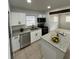Updated kitchen with stainless steel appliances, granite countertops, and modern cabinetry, creating a chef's dream at 2818 Geoffrey Dr, Orlando, FL 32826