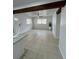 Bright living room featuring tile flooring, exposed beam, and a modern ceiling fan at 2818 Geoffrey Dr, Orlando, FL 32826