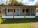 Inviting screened porch featuring wood supports and a white ceiling, perfect for enjoying the outdoors at 2818 Geoffrey Dr, Orlando, FL 32826