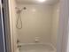 Bathroom tub and shower featuring bright white tiling at 314 Cherokee Ct # A, Altamonte Springs, FL 32701
