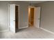 Bedroom view showcases the closet, doorway to the living space, and neutral walls at 314 Cherokee Ct # A, Altamonte Springs, FL 32701