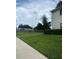 Exterior view showcasing the well-manicured lawn and side view of the condo at 314 Cherokee Ct # A, Altamonte Springs, FL 32701