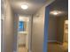 Hallway view of a bathroom featuring a vanity and updated fixtures at 314 Cherokee Ct # A, Altamonte Springs, FL 32701