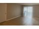 Living room with neutral paint, tile floors, and sliding glass doors to the outdoor area at 314 Cherokee Ct # A, Altamonte Springs, FL 32701