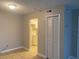 Open-concept living space with tile flooring, closet, and view of the kitchen at 314 Cherokee Ct # A, Altamonte Springs, FL 32701