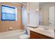 Well-maintained bathroom showcasing a bathtub, a toilet, and a sink with a vanity at 3733 Pyrite Dr, Orlando, FL 32826