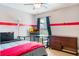 Bedroom showcasing a ceiling fan, a desk with a TV, and a dresser at 3733 Pyrite Dr, Orlando, FL 32826