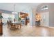 Inviting foyer and dining room features tile flooring, neutral paint and abundant natural light at 3733 Pyrite Dr, Orlando, FL 32826
