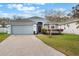 Charming single-story home featuring a brick-paved driveway and a well-manicured front lawn at 3733 Pyrite Dr, Orlando, FL 32826