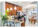 Kitchen features pendant lighting, breakfast bar, and stainless steel appliances at 3733 Pyrite Dr, Orlando, FL 32826
