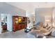 Comfortable living area with tile flooring and views to kitchen and bedroom hallway at 3733 Pyrite Dr, Orlando, FL 32826