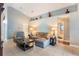 Cozy living room with neutral paint, tile floors and views of the bathroom at 3733 Pyrite Dr, Orlando, FL 32826