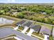 Aerial view of homes in a lush, green neighborhood at 3771 Whitetail Ct, St Cloud, FL 34772