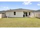 Spacious backyard featuring a well-manicured lawn and a patio at 3771 Whitetail Ct, St Cloud, FL 34772