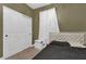 Bedroom features closet with sliding doors, and a white upholstered headboard bed with black bedding at 3771 Whitetail Ct, St Cloud, FL 34772