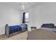 Bright bedroom with two twin beds and stylish lighting at 3771 Whitetail Ct, St Cloud, FL 34772