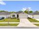 Charming single-story home featuring a well-maintained lawn and a paved two car driveway at 3771 Whitetail Ct, St Cloud, FL 34772