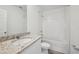 Bathroom with granite countertop and bath tub at 4002 Copperleaf Ln, Poinciana, FL 34759
