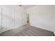 Bright bedroom boasts neutral walls and plush carpeting, creating a cozy, blank canvas at 4002 Copperleaf Ln, Poinciana, FL 34759