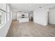 Open-concept kitchen featuring a breakfast bar and seamlessly connected to the living room at 4002 Copperleaf Ln, Poinciana, FL 34759