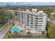 Aerial view of apartment building featuring a pool, balconies, and city view at 401 E Robinson St # 101, Orlando, FL 32801