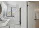 Bright bathroom with marble flooring, a dual-drawer vanity, and natural light from the window at 401 E Robinson St # 101, Orlando, FL 32801