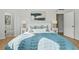 Serene bedroom with a king-size bed, decorative pillows, and access to an en-suite bathroom at 401 E Robinson St # 101, Orlando, FL 32801