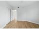 Neutral bedroom with light wood floors and double closets offering space and functionality at 401 E Robinson St # 101, Orlando, FL 32801