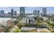 Scenic view of downtown skyline, showcasing a nearby lake and lush greenery surrounding the building at 401 E Robinson St # 101, Orlando, FL 32801