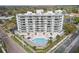 Beautiful exterior showcases the building, pool, and lush landscaping of the property at 401 E Robinson St # 101, Orlando, FL 32801