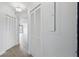 Bright hallway with wood floors and white doors leading into the condo's inviting living spaces at 401 E Robinson St # 101, Orlando, FL 32801