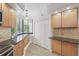 Efficient kitchen with granite counters, under-cabinet lighting, stainless appliances, and storage at 401 E Robinson St # 101, Orlando, FL 32801
