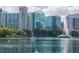 Picturesque lake view featuring downtown highrise office buildings and paddle boats at 401 E Robinson St # 101, Orlando, FL 32801