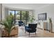Bright living room with floor-to-ceiling windows offering scenic views and comfortable seating arrangement at 401 E Robinson St # 101, Orlando, FL 32801