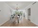 Bright living room with stylish decor adjacent to dining area and functional butler pantry at 401 E Robinson St # 101, Orlando, FL 32801