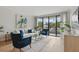 Comfortable living room with a view to the balcony, featuring tile floors, and contemporary furnishings at 401 E Robinson St # 101, Orlando, FL 32801