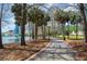 Scenic park path with tall trees, lush greenery, and views of lake and cityscape at 401 E Robinson St # 101, Orlando, FL 32801