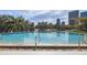 Enjoy a refreshing swim in the sparkling pool, surrounded by lush landscaping and city views at 401 E Robinson St # 101, Orlando, FL 32801