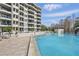 Beautiful community pool with city views, featuring lounge chairs and plenty of space for relaxation at 401 E Robinson St # 101, Orlando, FL 32801