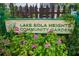 Lake Eola Heights Community Garden sign surrounded by vibrant flowers and foliage at 401 E Robinson St # 101, Orlando, FL 32801