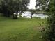 Backyard view showcases a lake and green grass at 4120 Plantation Cove Dr # 301, Orlando, FL 32810